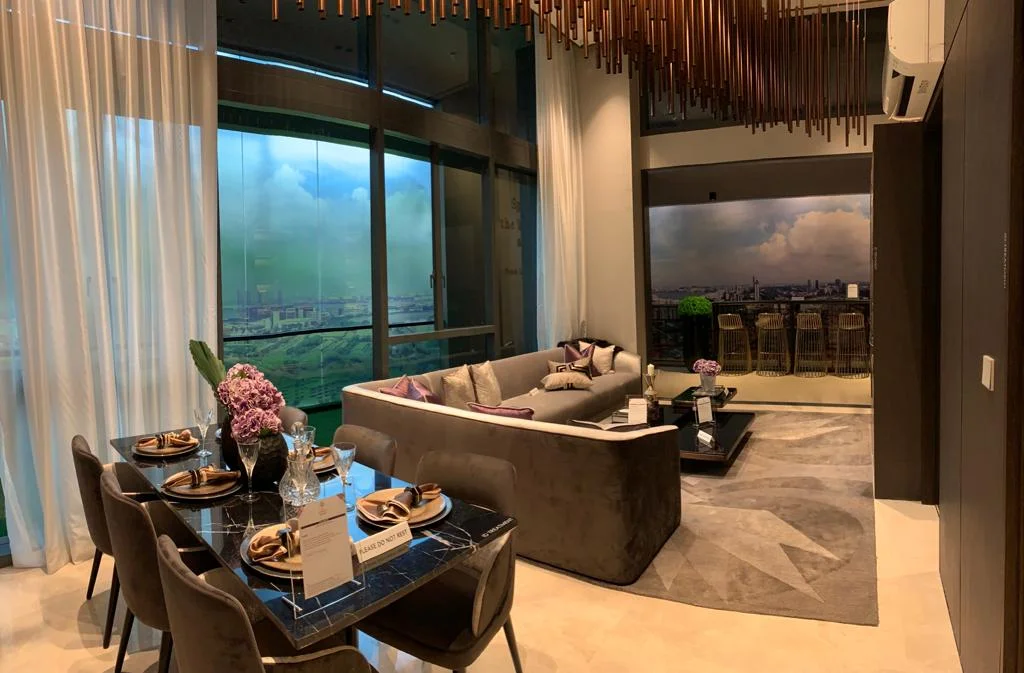 5-bedroom showflat living hall opening to balcony with sea views